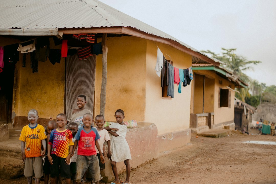 family standing in front of house